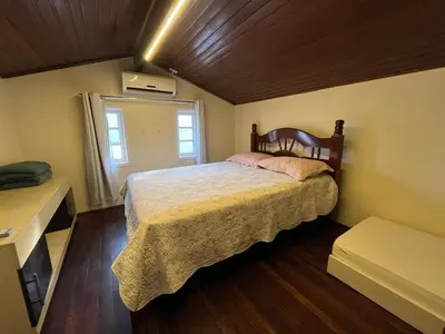 Uma cama ou camas num quarto em Casa de Praia