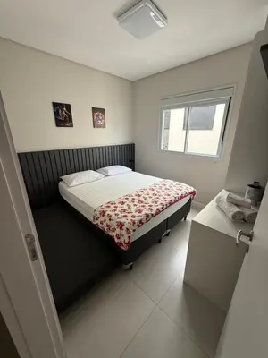 Uma cama ou camas num quarto em Apartamento Carlos Daniela