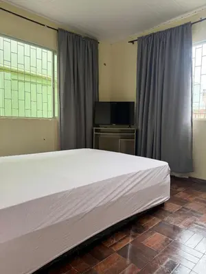 Uma cama ou camas num quarto em Casa de temporada