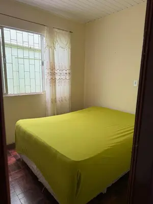 Uma cama ou camas num quarto em Casa de temporada