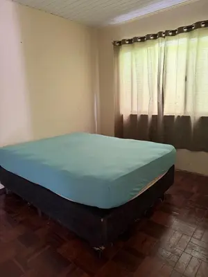 Uma cama ou camas num quarto em Casa de temporada