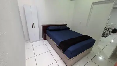 Uma cama ou camas num quarto em Apartamento espaçoso com 2 quartos