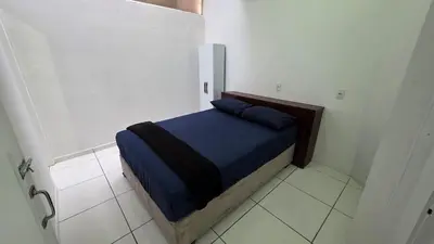 Uma cama ou camas num quarto em Apartamento espaçoso com 2 quartos