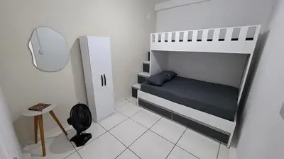 Uma cama ou camas num quarto em Apartamento espaçoso com 2 quartos