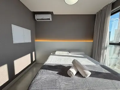 Uma cama ou camas num quarto em Vista Mar, Suíte Moderna para até 3 Pessoas