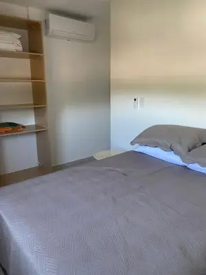 Uma cama ou camas num quarto em Itapema Apartment - Casa Branca