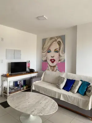 Uma televisão e/ou sistema de entretenimento em Itapema Apartment - Casa Branca