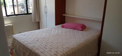 Uma cama ou camas num quarto em Itapema predio rua 292