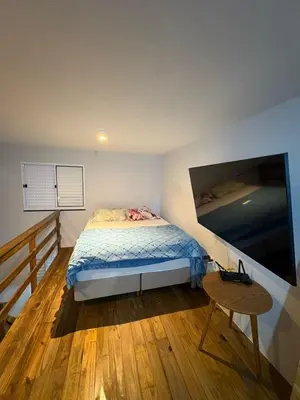 Uma cama ou camas num quarto em Casa Geminada