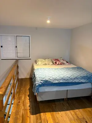 Uma cama ou camas num quarto em Casa Geminada
