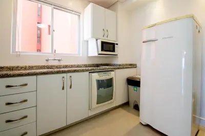 A cozinha ou kitchenette de Frente Mar Barra Sul com 3 Quartos SG7825