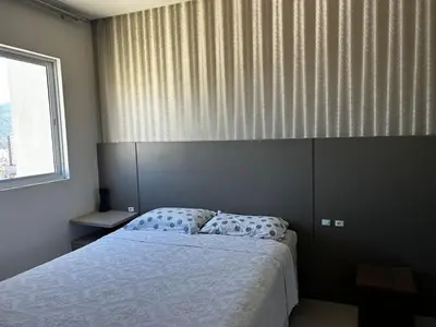 Uma cama ou camas num quarto em Bela Vista em Itapema, Santa Catarina