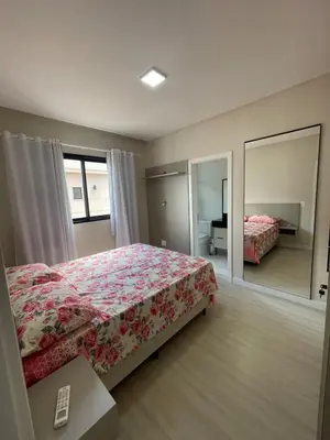 Uma cama ou camas num quarto em Cobertura com vista Mar em Meia Praia Itapema