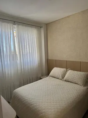Uma cama ou camas num quarto em Apartamento 600mt da praia vista mar