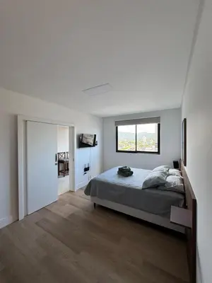 Uma cama ou camas num quarto em Pré Carnaval na Praia de Itapema SC, 8 Vista Mar