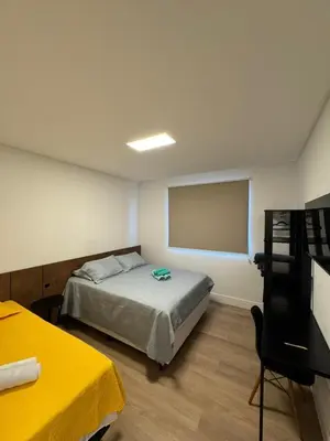 Uma cama ou camas num quarto em Pré Carnaval na Praia de Itapema SC, 8 Vista Mar
