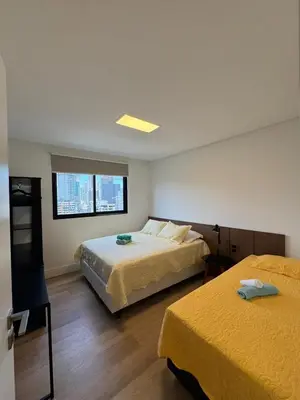 Uma cama ou camas num quarto em Pré Carnaval na Praia de Itapema SC, 8 Vista Mar