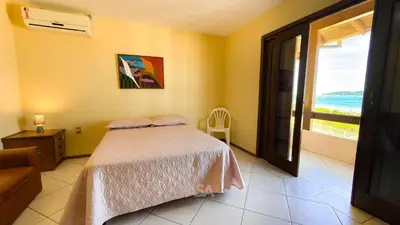 Uma cama ou camas num quarto em ASA | Casa Pé na Areia Zimbros | Bombinhas | 4QT