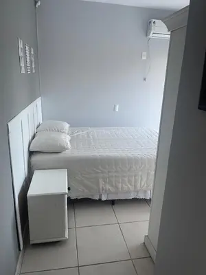 Uma cama ou camas num quarto em duplex vista mar Mariscal 4 dormitórios