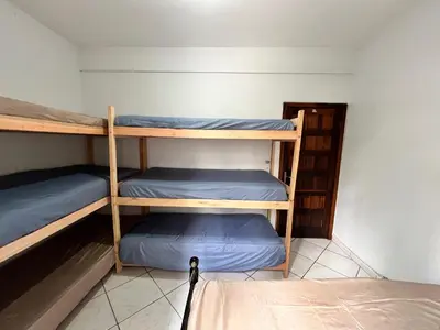 Uma cama ou camas num quarto em Brisa do mar