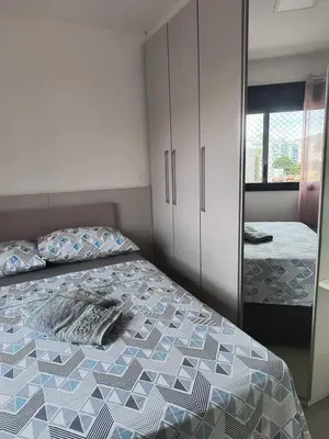 Uma cama ou camas num quarto em Excelente apartamento com 3 quartos disponíveis Palmas SC próximo a praia - 2 quartos e sala com ar condicionado
