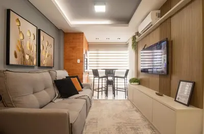 Uma área de estar em SLE72 - 2 Dorm, Climatizado, Smart TV, Barra Sul