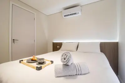 Uma cama ou camas num quarto em SLE72 - 2 Dorm, Climatizado, Smart TV, Barra Sul