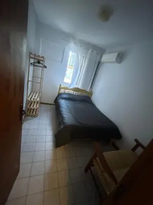 Uma cama ou camas num quarto em Depto para 5 , 50 Mtrs del mar