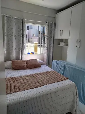 Uma cama ou camas num quarto em Casa férias em bombinhas