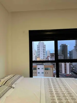 Uma cama ou camas num quarto em Apartamento amplo com Churrasqueira próximo ao Hard Rock Café