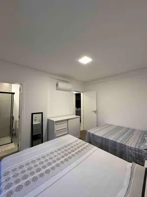 Uma cama ou camas num quarto em Apartamento amplo com Churrasqueira próximo ao Hard Rock Café