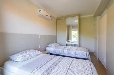 Uma cama ou camas num quarto em Apartamento Super Luxo c 3 Suites