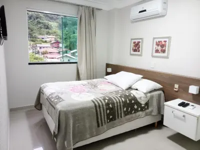 Uma cama ou camas num quarto em Summer praia e natureza