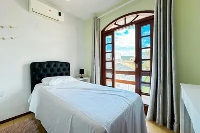Uma cama ou camas num quarto em Casa RenaPaty - Praia de Palmas