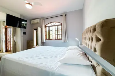 Uma cama ou camas num quarto em Casa RenaPaty - Praia de Palmas