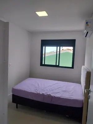 Uma cama ou camas num quarto em Apartamento na Praia de Palmas com 3 quartos