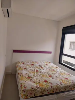 Uma cama ou camas num quarto em Apartamento na Praia de Palmas com 3 quartos