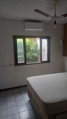 Uma cama ou camas num quarto em Bercam Residencial Gavião Beach House