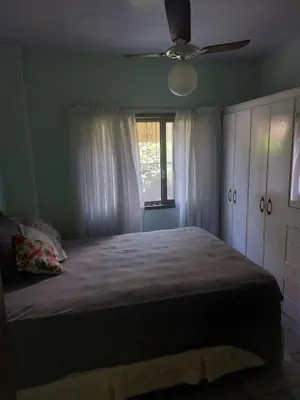 Uma cama ou camas num quarto em Bercam Residencial Gavião Beach House