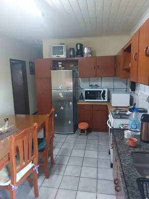 A cozinha ou kitchenette de Bercam Residencial Gavião Beach House