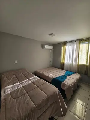 Uma cama ou camas num quarto em CASA LINDA VISTA - 3 Quartos