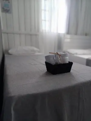 Uma cama ou camas num quarto em Calheiros Beach house