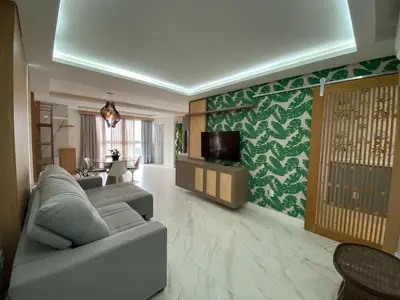 Uma televisão e/ou sistema de entretenimento em Top apartment near the new Pier Oporto