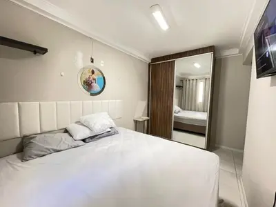 Uma cama ou camas num quarto em Apartamento Confortável na Praia de Bombas