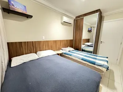 Uma cama ou camas num quarto em Apartamento Confortável na Praia de Bombas