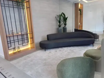 Uma área de estar em Apartamento Itapema