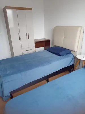 Uma cama ou camas num quarto em Apartamento Itapema