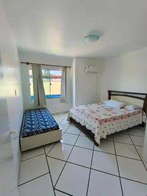 Uma cama ou camas num quarto em Casa com a melhor vista, pé na areia
