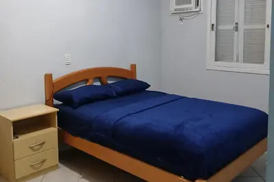 Uma cama ou camas num quarto em Apto panorâmico