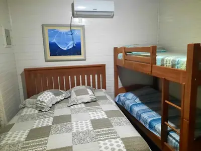 Uma cama ou camas num quarto em Casa de Praia em Palmas a 280m do Mar
